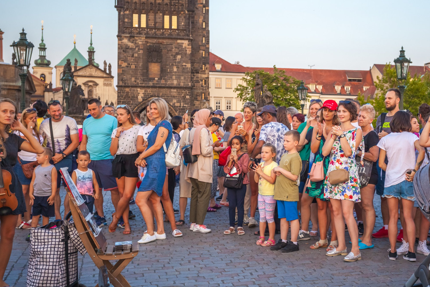 People are walking over the famous Charles Bridge in Prague..jpg